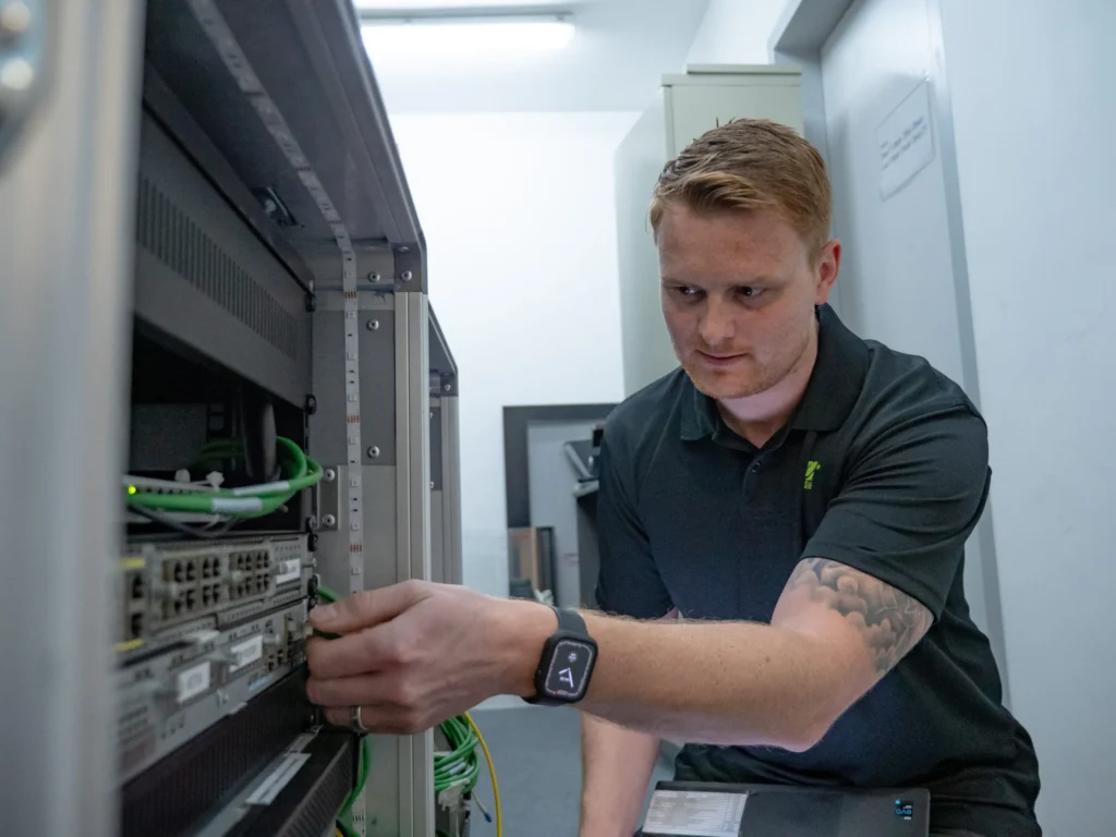 BGN employee working on a server for an event